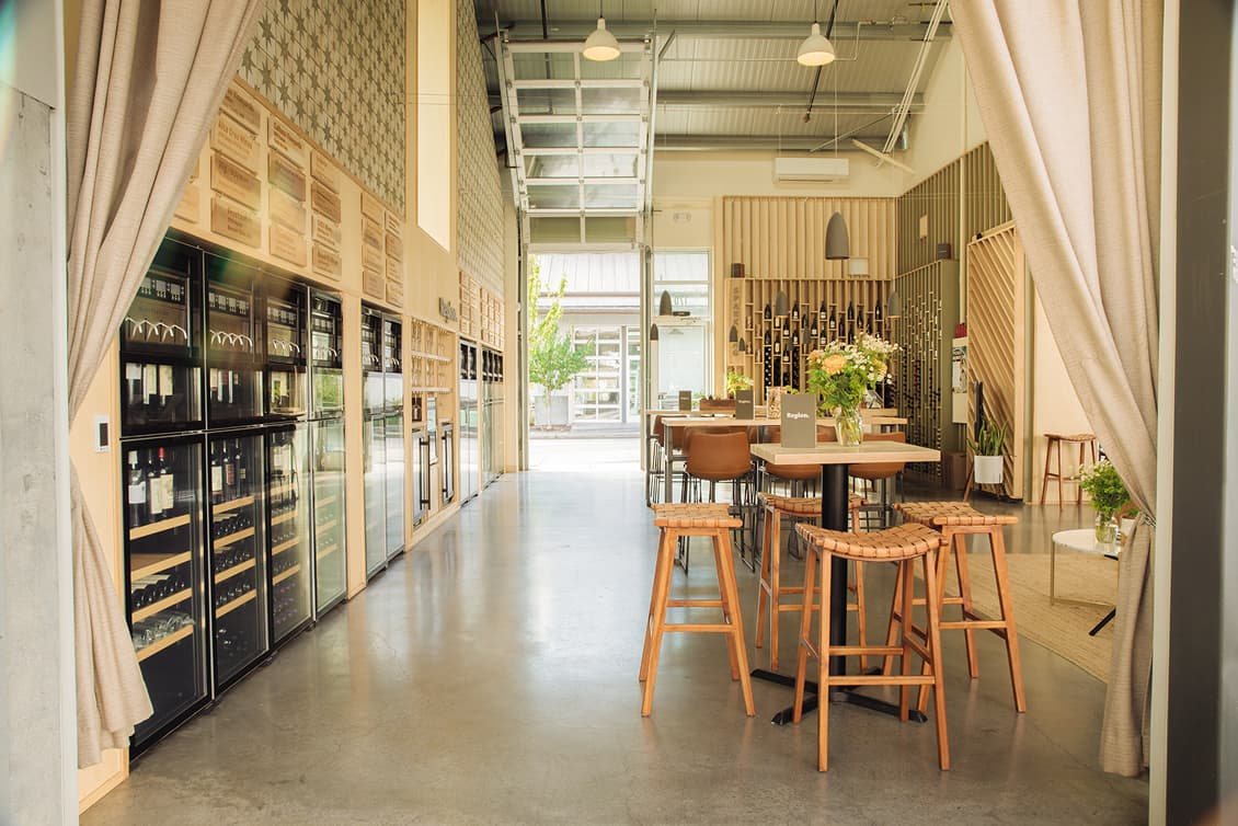 Region.Sonoma tasting room with self-pour wine stations and high-top tables