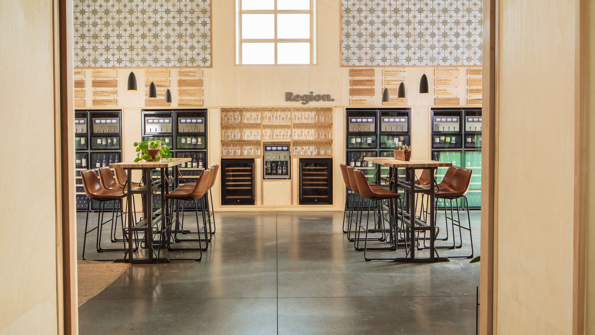 The main hall at Region.Sonoma with its tiled gable wall and wine dispensers